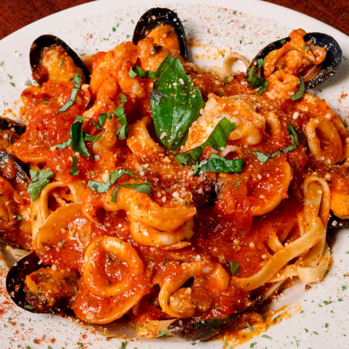 Seafood pasta with mussels in tomato sauce